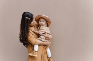 asian mom holding asian baby after having therapy in simi valley